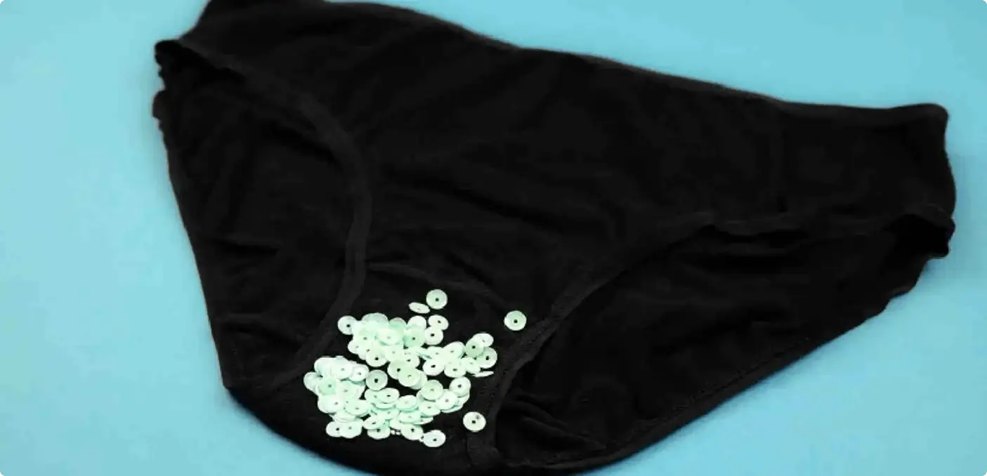 Illustration of a pad with blood on it